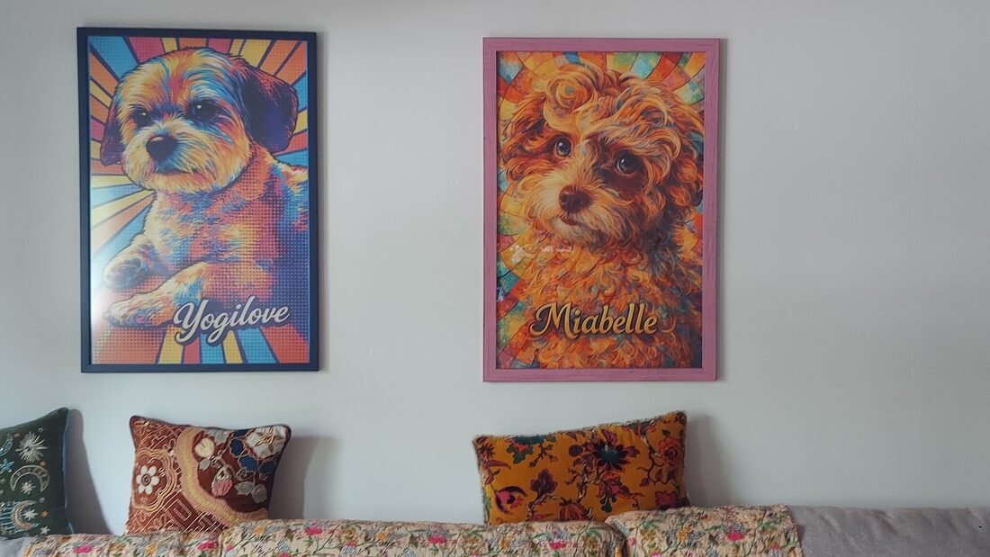 Yogi and Mia portraits side by side on the wall